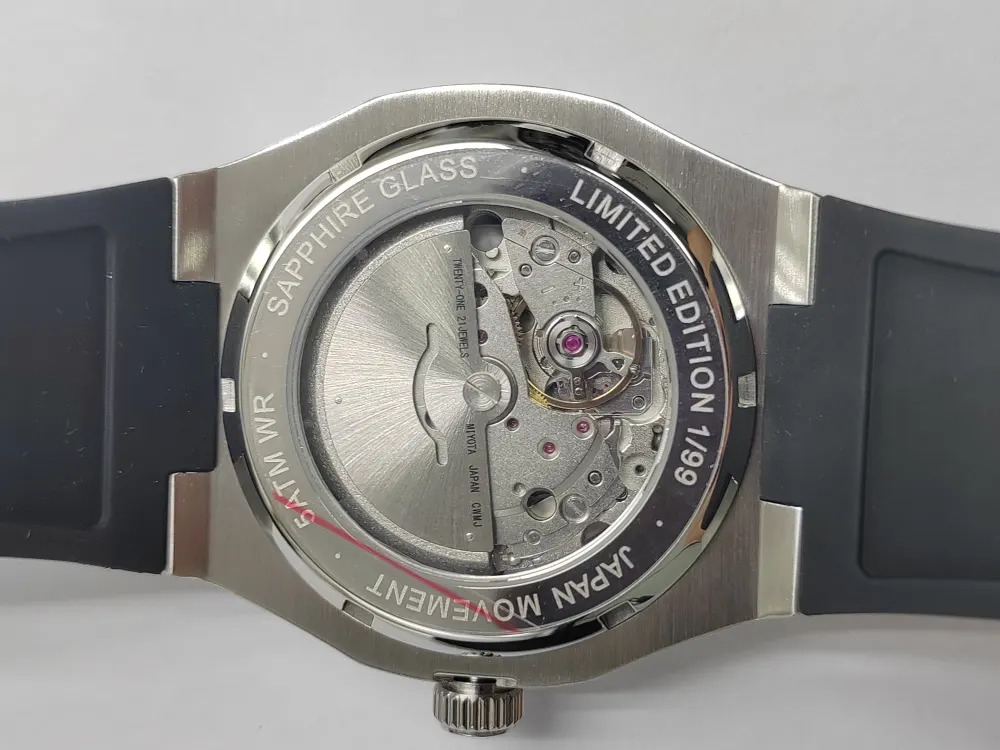 The caseback on grey, rotor visible.