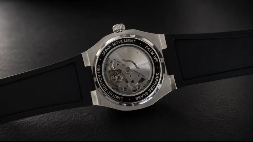 The caseback in a dark studio.