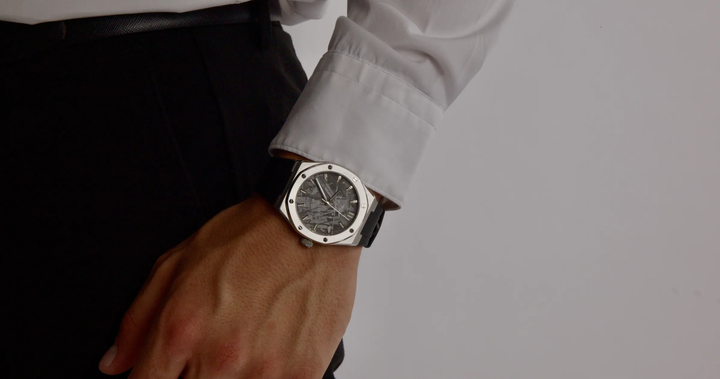 The Visto at a dark shirt cuff in low light.